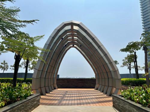 an archway in a park with trees at Gold Coast Apartment PIK Luxury Sea View by stay with E in Jakarta