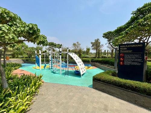 a playground in a park with a roller coaster at Gold Coast Apartment PIK Luxury Sea View by stay with E in Jakarta