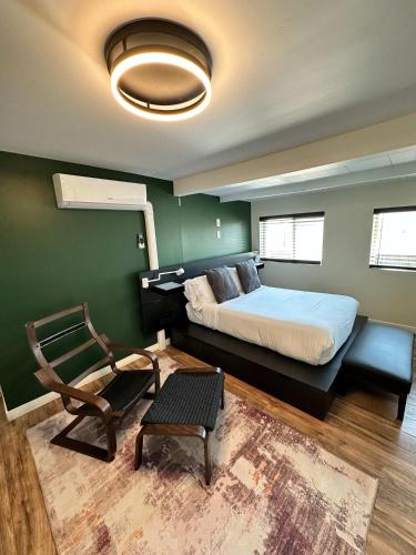 a bedroom with a bed and a chair in it at Special Studio in Center of San Diego in San Diego