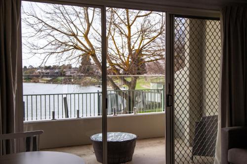a sliding glass door to a balcony with a view at Nagambie Waterfront Motel in Nagambie