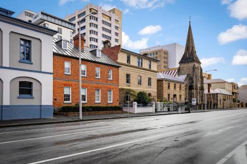 an empty city street with buildings and a church at 55 Davey Townhouse 2, Salamanca on your doorstep in Hobart