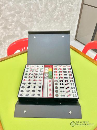 a laptop computer sitting on top of a table at Landed Austin Homestay 11 Pax KTV Mahjong BBQ Glenmarie by Stayrene in Johor Bahru