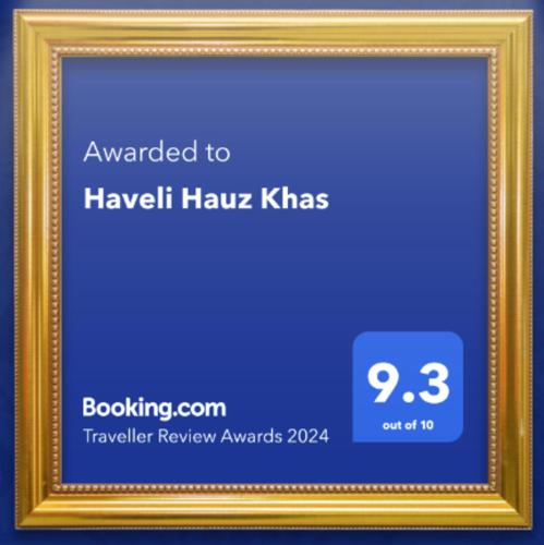 a gold picture frame with a blue background at Haveli Hauz Khas in New Delhi