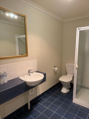 a bathroom with a sink and a toilet at Douglas Riverside in Port Fairy
