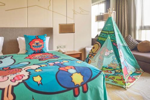 a bedroom with a bed with a christmas tree on it at Holiday Inn Shanghai Hongqiao by IHG - near by Hongqiao Airport & NECC in Shanghai