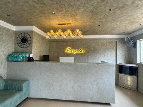 a lobby with a reception desk in a room at DREAMZ LUXURY HOMe in Kammasandra