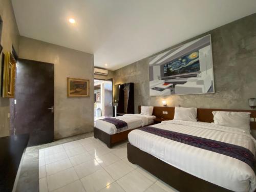 Postel nebo postele na pokoji v ubytování Watu Agung Guest House