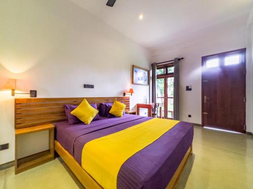 Postel nebo postele na pokoji v ubytování Tropical Villa - Weligama
