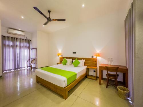 Postel nebo postele na pokoji v ubytování Tropical Villa - Weligama