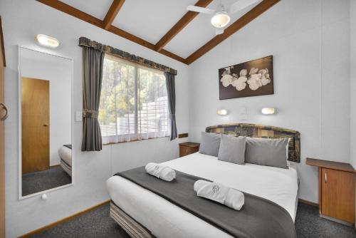 Ένα ή περισσότερα κρεβάτια σε δωμάτιο στο Metung Holiday Villas