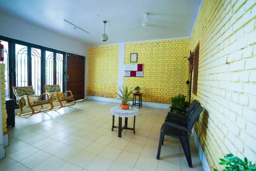 Posezení v ubytování Krimson Bricks Homestay