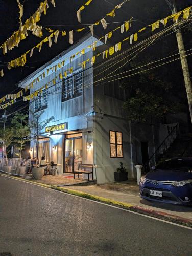 a building with a car parked in front of it at Villanueva House in Liliw
