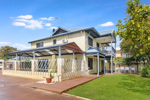 a house with an awning on the front of it at Observatory Guesthouse - Adults Only in Busselton
