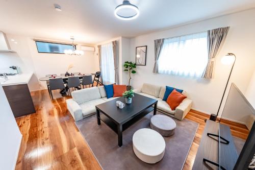 a living room with a couch and a table at HOTEL Grand Star Tokyo in Tokyo