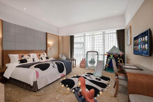 a bedroom with a large bed with a cow rug at Grand Scent Hotel in Chengdu