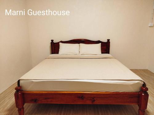 Ένα ή περισσότερα κρεβάτια σε δωμάτιο στο Marni Guesthouse