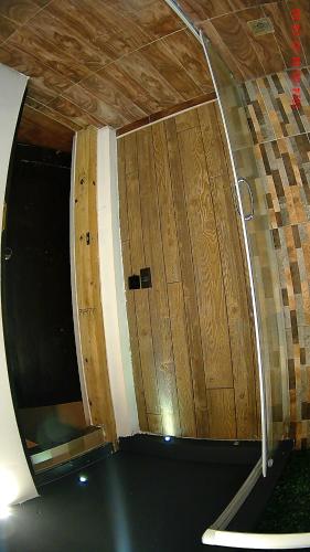 a pair of wooden doors in a room at Hotel Casona del Truco in Guanajuato