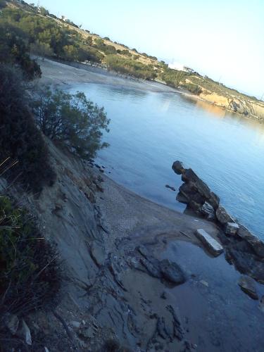a view of a river with rocks in the water at seaside Ktima KaParos PAROS in Drios