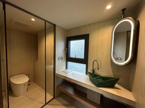 a bathroom with a sink and a mirror at 陌上是舍uptownFARM in Chang-she-chen