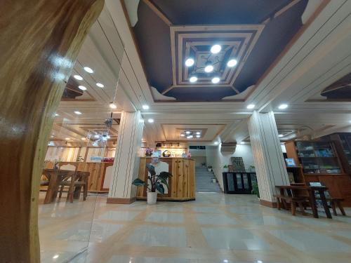 a lobby of a store with a coffered ceiling at Quarrybay Hometel Sagada in Sagada