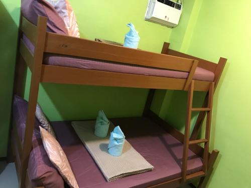 Postel nebo postele na pokoji v ubytování Elmo’s place