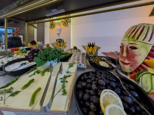 a table topped with lots of different types of food at Quality Gold Suite Hotel in Antalya