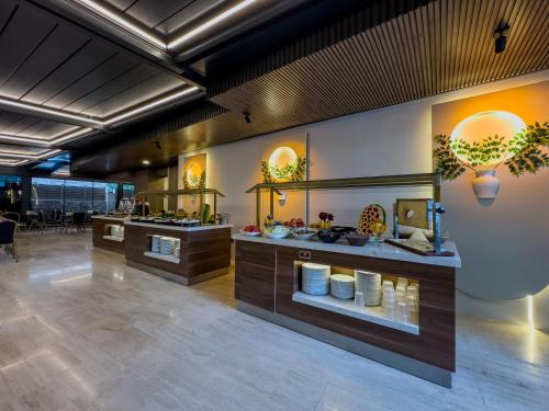 a lobby with a store with aasteryasteryasteryasteryasteryasteryasteryasteryastery at Quality Gold Suite Hotel in Antalya