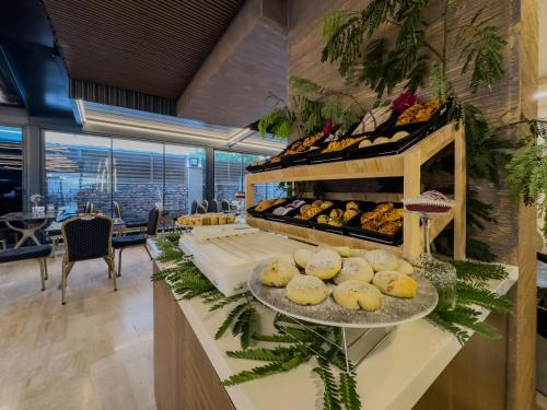 a bakery with a display of bread and pastries at Quality Gold Suite Hotel in Antalya