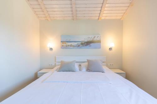 En eller flere senge i et værelse på Luv & Lee