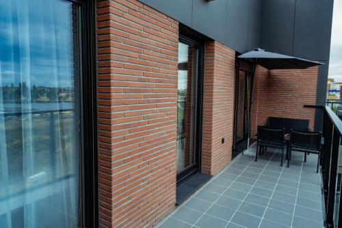 Balkón alebo terasa v ubytovaní APARTMENTS NADMOTŁAWIE- Gym, Sauna & Free parking