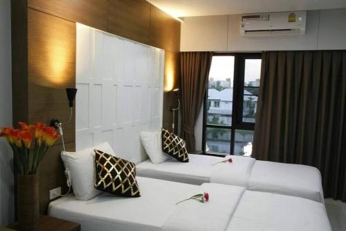 Postel nebo postele na pokoji v ubytování Baan Bangkok 97 Hotel