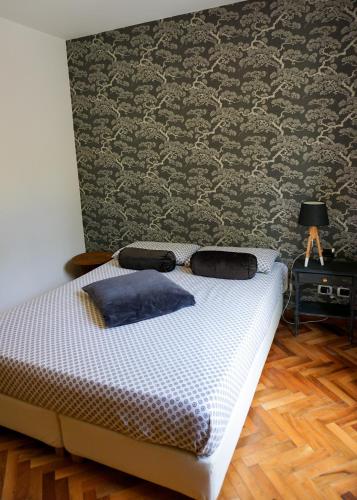 a bed in a room with a wall at La Bolla Verde Lake Como in Lecco