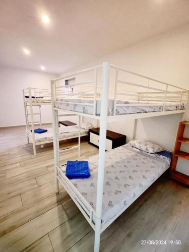 a bedroom with two bunk beds in a room at Seixal Bay Village - Family Choice in Seixal