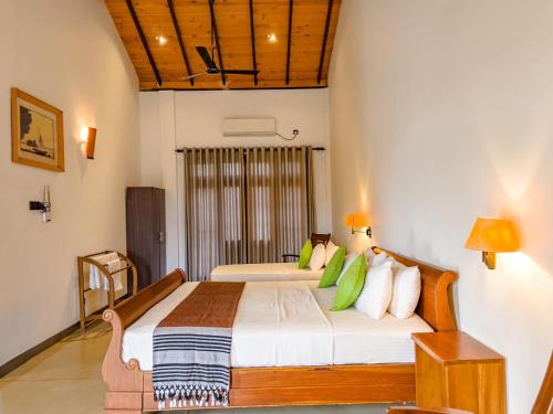 Postel nebo postele na pokoji v ubytování Tropical Villa - Weligama