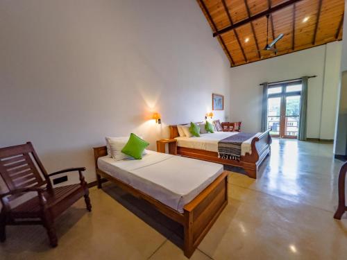 Postel nebo postele na pokoji v ubytování Tropical Villa - Weligama