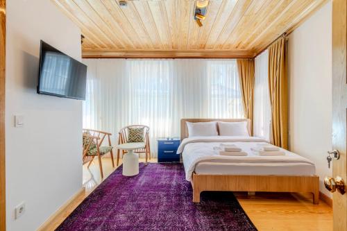 Postel nebo postele na pokoji v ubytování Evra Suites Hotel