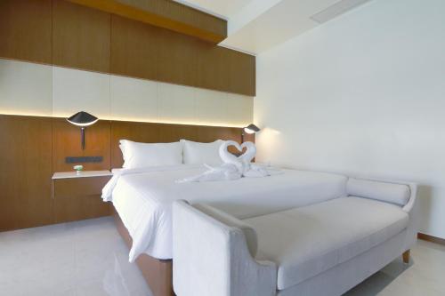 Ένα ή περισσότερα κρεβάτια σε δωμάτιο στο Choasis Hotel-Luang Prabang