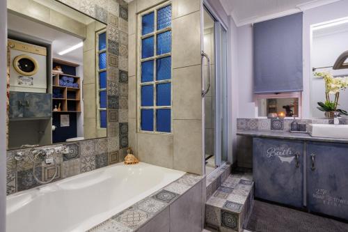 a large bathroom with a tub and a sink at Mountain Bliss at Reebok Rus in Reebok