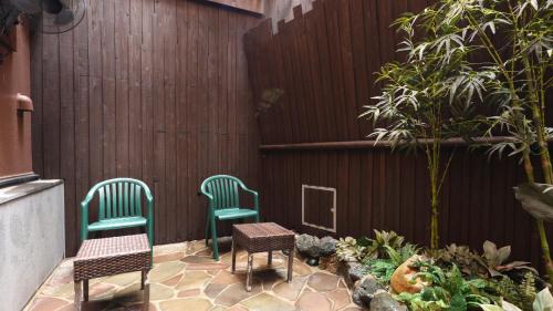 two chairs and a table on a patio at Dormy Inn Sendai Annex in Sendai