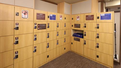 a row of lockers in a locker room at Dormy Inn Sendai Annex in Sendai