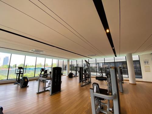 a gym with treadmills and machines in a building at Veranda-2BR,4pax I 5mins to CIQ and KSL I Fast-Wifi in Johor Bahru