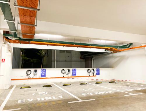 a parking lot with a row of sinks in a parking garage at Veranda-2BR,4pax I 5mins to CIQ and KSL I Fast-Wifi in Johor Bahru