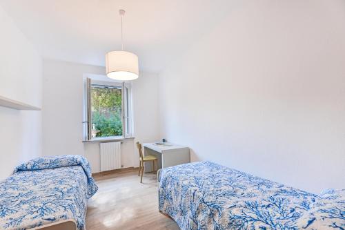 Ένα ή περισσότερα κρεβάτια σε δωμάτιο στο Casa G un Giardino su Portoferraio
