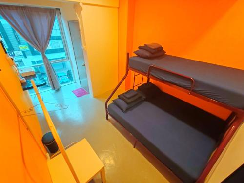 Postel nebo postele na pokoji v ubytování The Cocoon Capsule Hotel