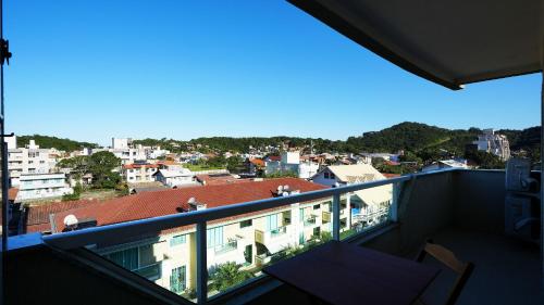a balcony with a view of a city at Edifício Costa Mar - Centro de Bombinhas in Bombinhas
