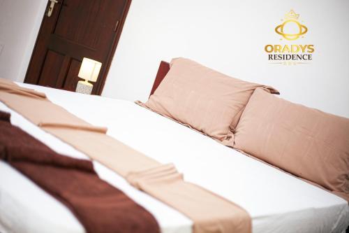 Ein Bett oder Betten in einem Zimmer der Unterkunft ORADYS Residence