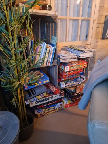 a pile of books sitting on top of a table at de Tweelingen in Schoonloo