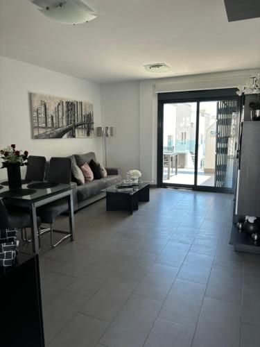 Posezení v ubytování OasisBeach Penthousse la Zénia