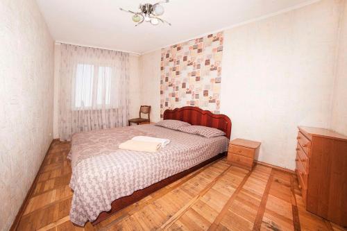 Llit o llits en una habitació de Topol Apartment