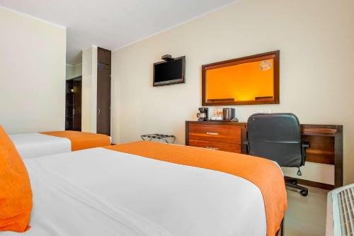 Кровать или кровати в номере Comfort Inn Cancún Aeropuerto